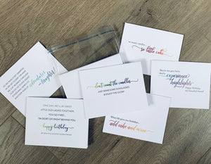 Six white birthday cards are overlapping on a wooden background. Each card has a mix of fonts, including ombre script. Each card has a funny birthday-inspired sentiment. Birthday Smiles Collection by Stationare.