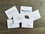 Set of 6 white notecards lie on a wooden background. Each card has a sentiment expressing gratitude.