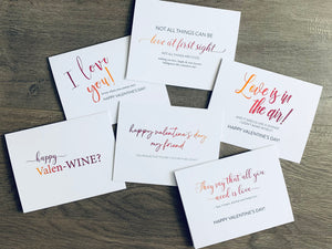 Six white notecards lie overlapped on a wooden background. Each card has orange to purple ombre-colored type. The sentiments are fun, light and based on friendship. Valentine Smiles Collection by Stationare.