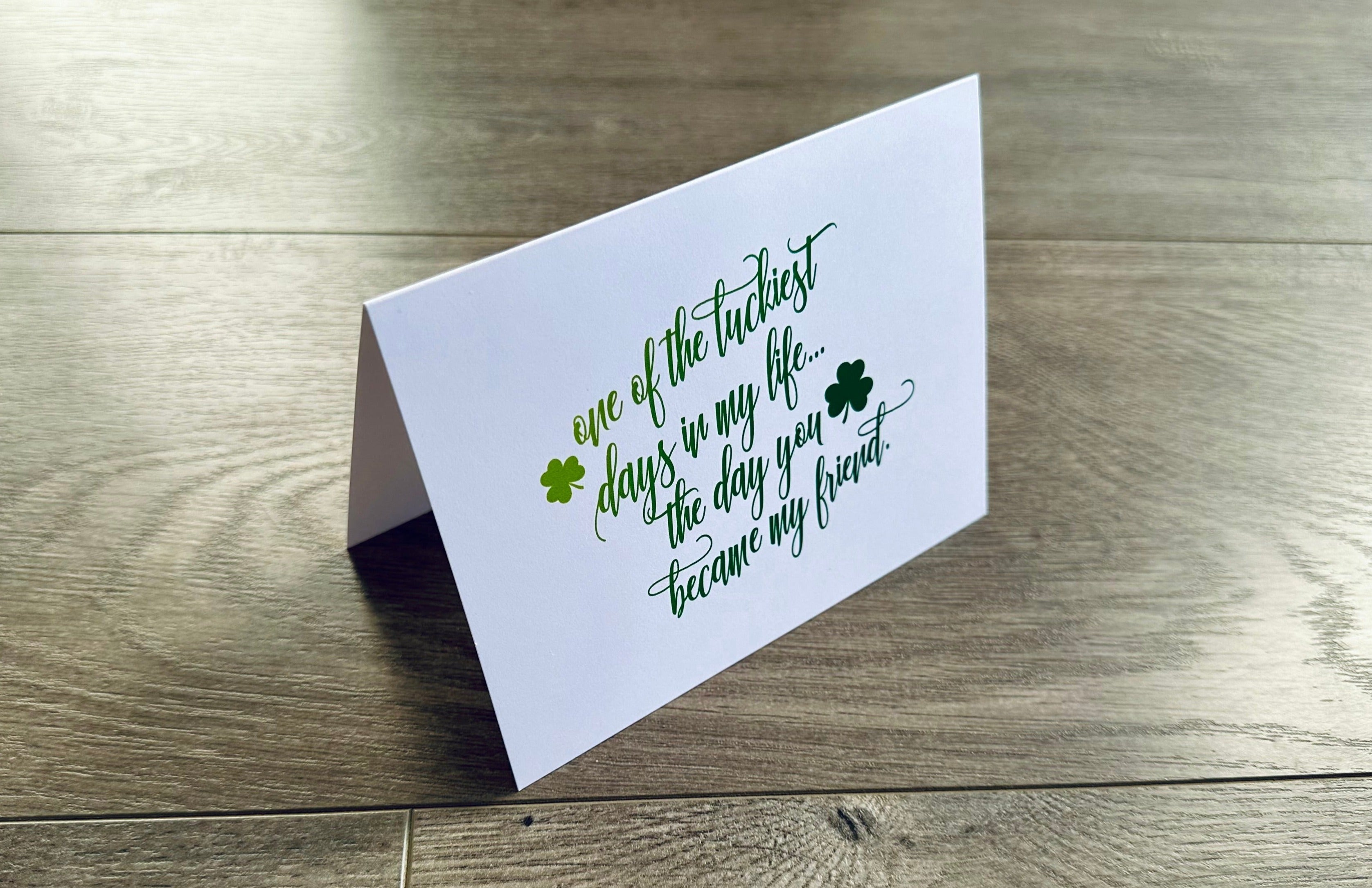 A white notecard reads, "one of the luckiest days in my life... the day you became my friend." Friendship Luck by Stationare.