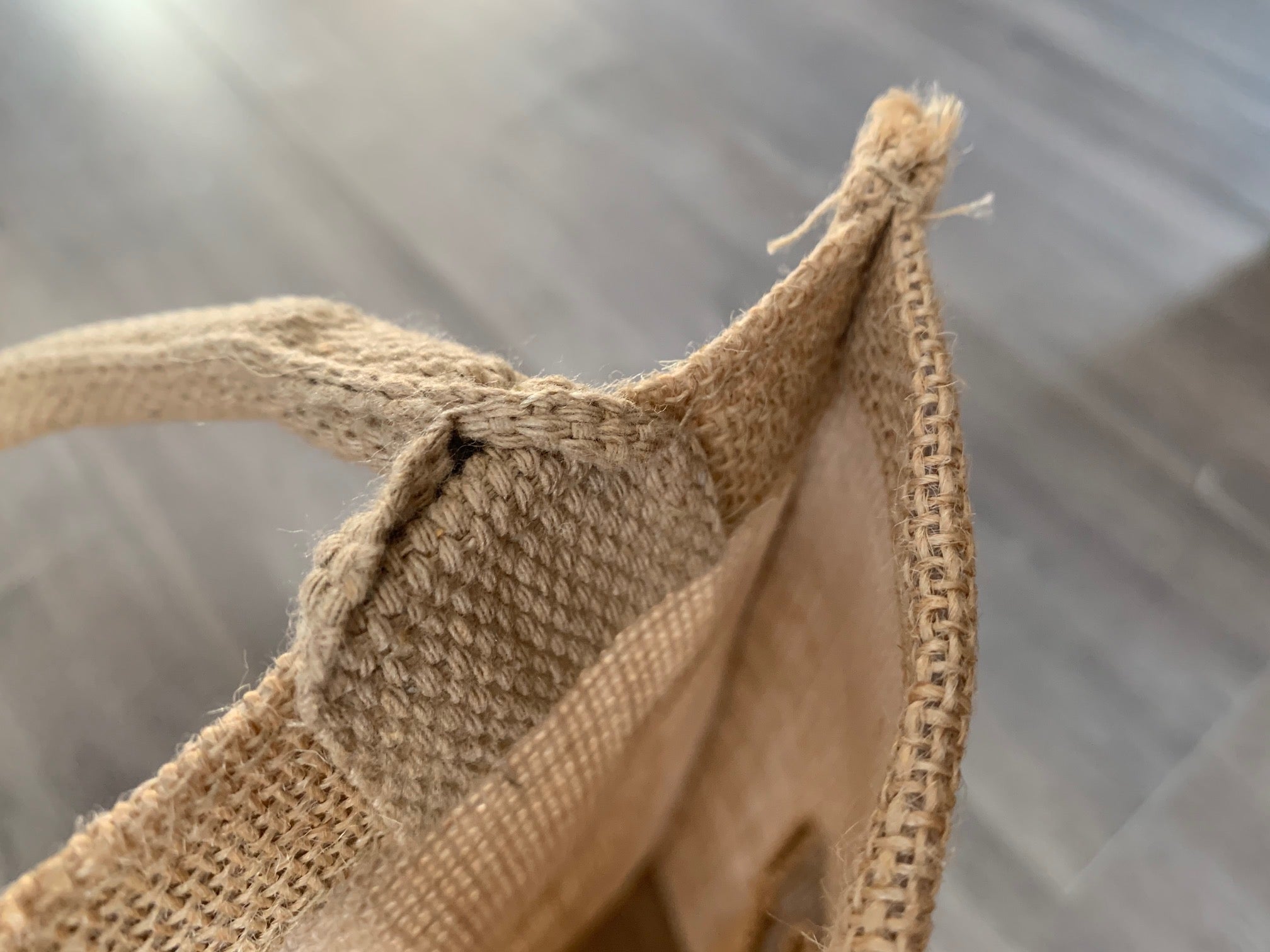 closeup of handle and interior of 4 bottle jute tote by stationare