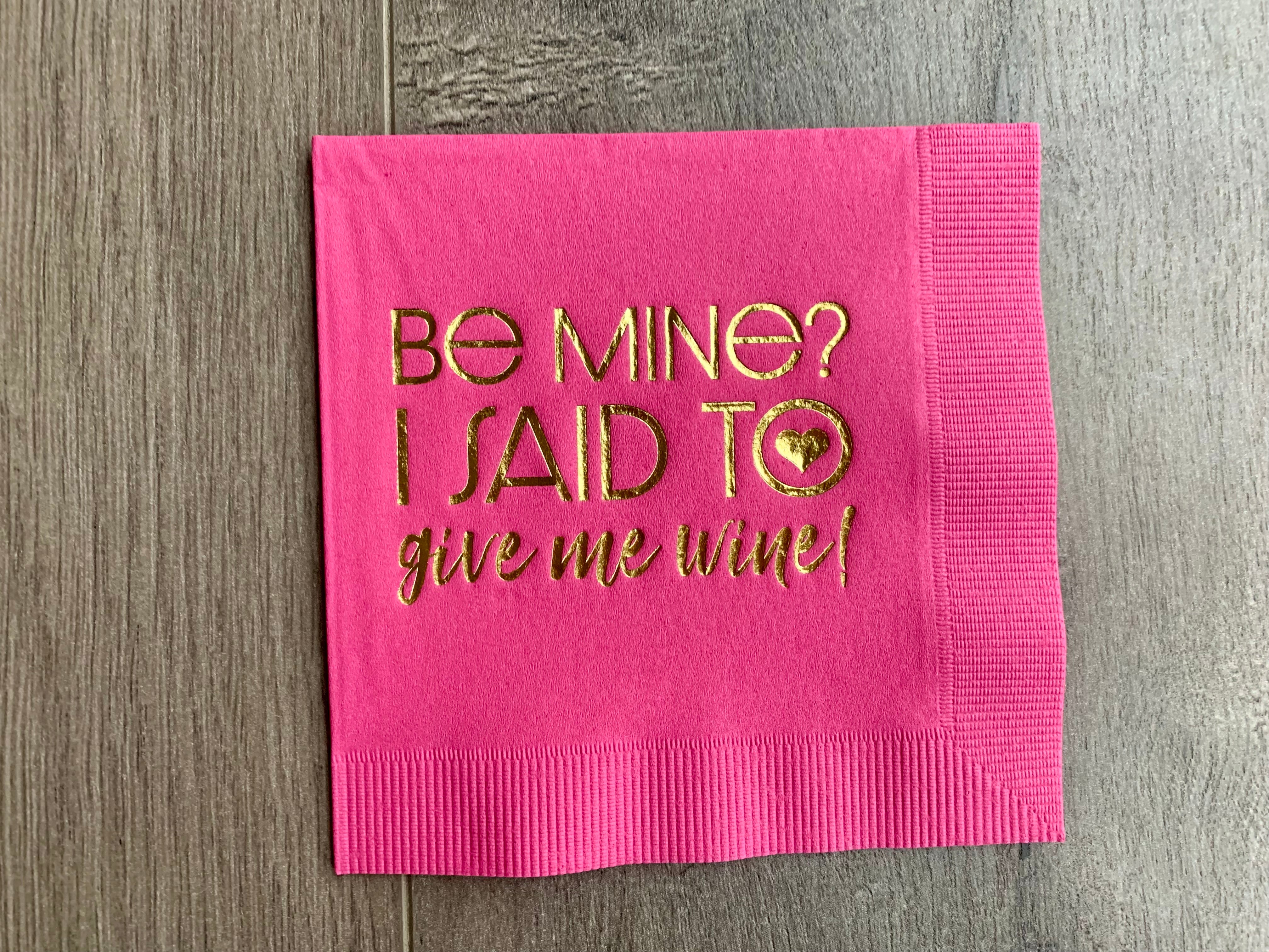 bright pink cocktail napkin with gold foil that says Be Mine? I said to give me wine! by Stationare, galentines day party, valentines day cocktail napkin