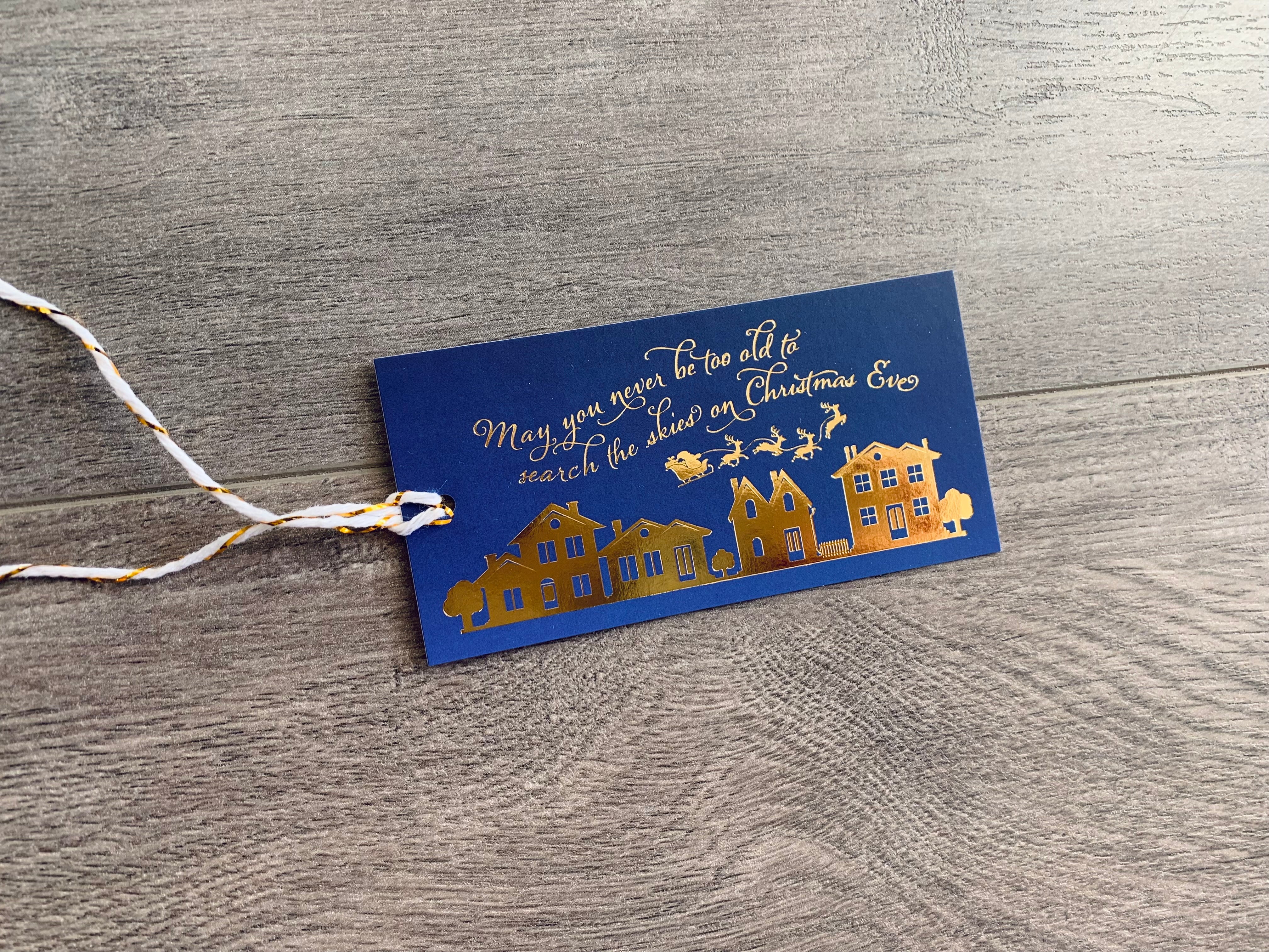 search the skies on christmas eve gold foil and navy christmas hang tag by stationare