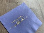closeup image of Stationare's periwinkle cocktail napkin with metallic gold foil that reads "so many candles... so little cake"
